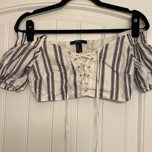 Forever 21 small white/ navy blue crop top. Ties on the front.